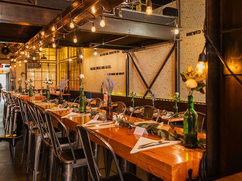 Long harvest tables set for a reception at Uptown Waterloo