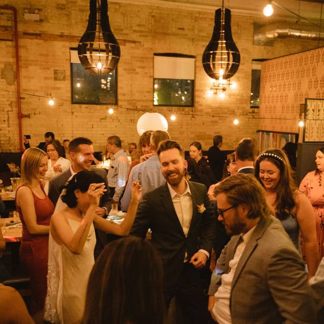 Guests celebrating together in the brick dining room