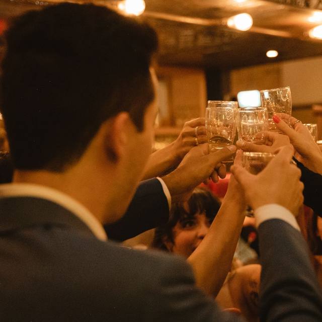 Guests raising their glasses in a toast